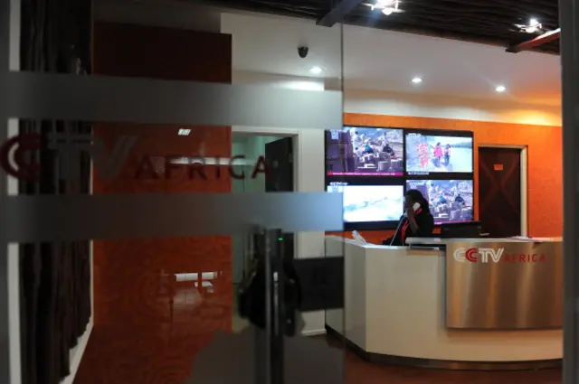 This picture taken on June 12, 2012 shows an employee talking on the phone in China Central Television (CCTV) Africa's premises in Nairobi. CCTV Africa, which employs about sixty people, was the first regional bureau to produce and broadcast its own hour-long news programme on CCTV News.