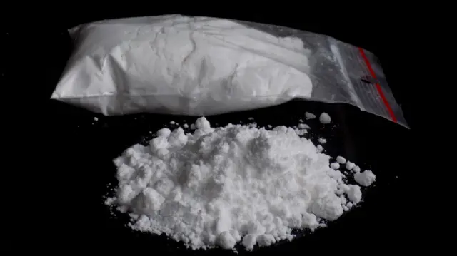 Bag and pile of white powder