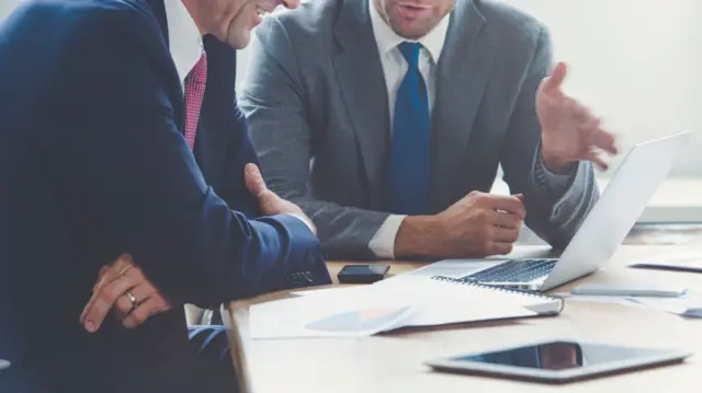 Two men in a meeting