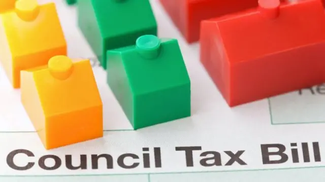 Plastic houses on a council tax bill