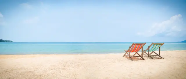 Deckchairs on a beach