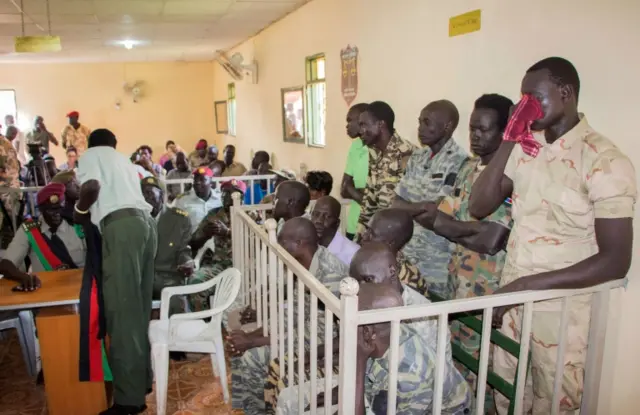 South Sudanese soldiers wait for their verdict at the military court in Juba, South Sudan, on September 6, 2018.