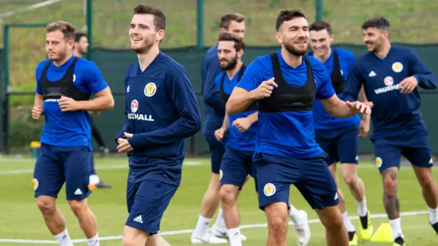 Andy Robertson (left) leads from the front at Scotland training