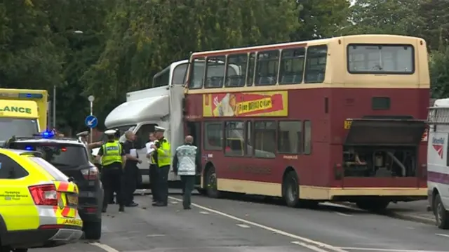 Emergency service crew attend scene of bus crash