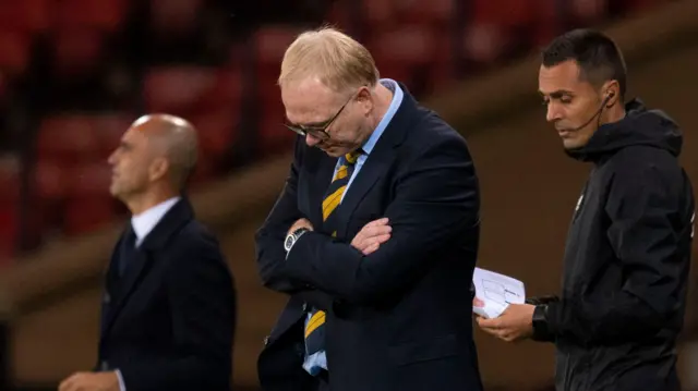 Scotland head coach Alex McLeish looks at the ground on the touchline