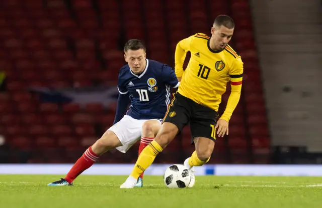 Scotland's Callum McGregor chases Eden Hazard