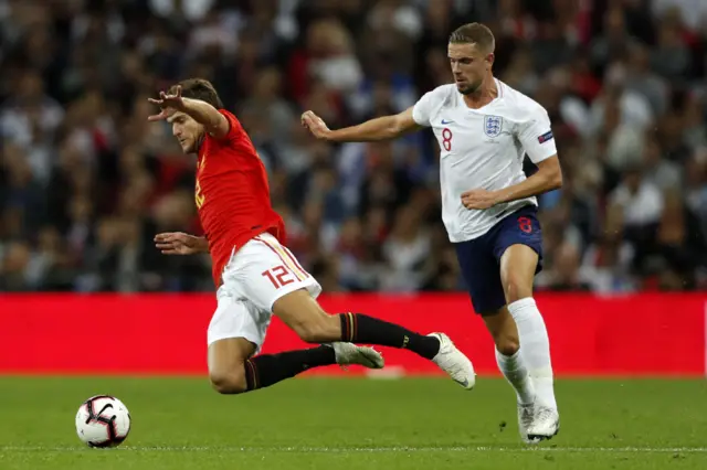 Jordan Henderson fouls Marcos Alonso