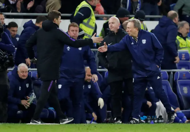 Pochettino and Warnock shake hands