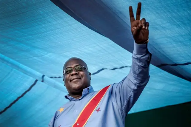 In this file photo taken on December 21, 2018 Democratic Republic of Congo"s Union for Democracy and Social Progress (Union pour la Democratie et le Progres Social - UDPS) party leader and presidential candidate Felix Tshisekedi waves to the crowd during a campaign rally in Kinshasa