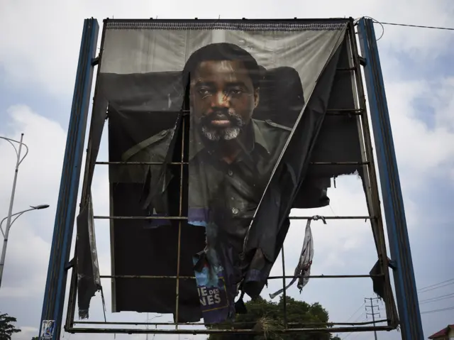 A billboard of DR Congo"s outgoing President Joseph Kabila burned by supporters of the opposition leader Felix Tshisekedi, the leader of the Union for Democracy and Social Progress (UDPS) party, is seen in Limete, Kinshasa, Democratic Republic of the Congo, 10 January 2019