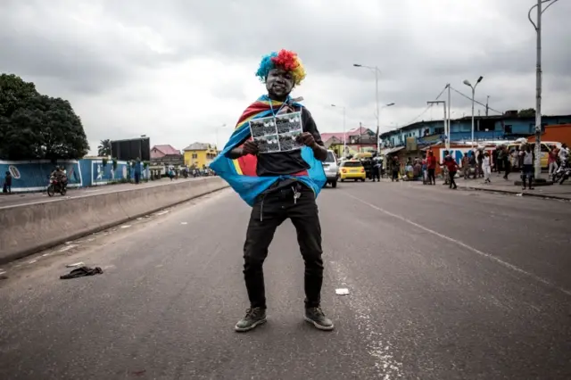 A supporter of the newly elected president of the Democratic Republic of Congo, Felix Tshisekedi, celebrates in the streets of Kinshasa on January 10, 2019