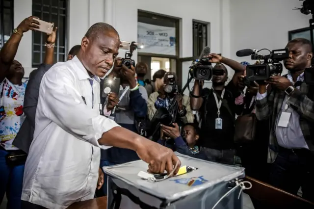 In this file photo taken on December 30, 2018 presidential candidate Martin Fayulu casts his vote at the Insititut de la Gombe polling station during the DR Congo"s general elections in Kinshasa