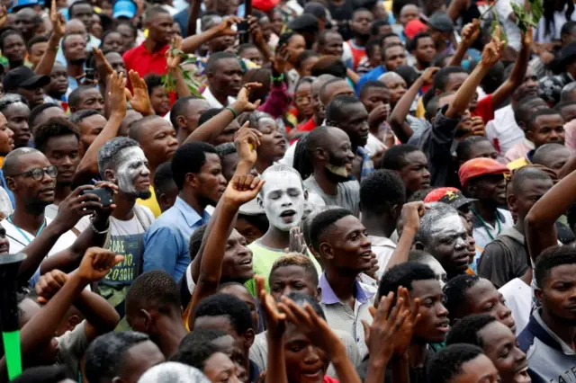 Supporters of Felix Tshisekedi, leader of the Congolese main opposition party, the Union for Democracy and Social Progress (UDPS) who was announced as the winner of the presidential elections, celebrate outside the party"s headquarters in Kinshasa