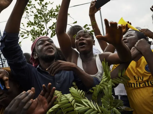 Supporters of DR Congo's opposition leader Felix Tshisekedi, the leader of the Union for Democracy and Social Progress (UDPS) party, celebrate after he was declared the winner by electoral commission, in Limete, Kinshasa,