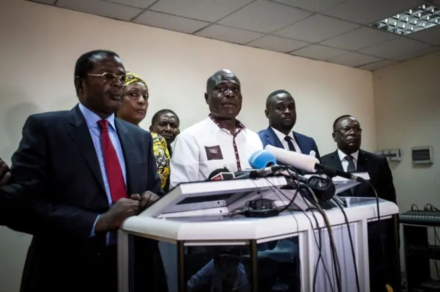 One of the main opposition candidates in the Democratic Republic of the Congo"s presidential elections to be held on December 30, Martin Fayulu (C), addresses the press on December 25, 2018 in Kinshasa.