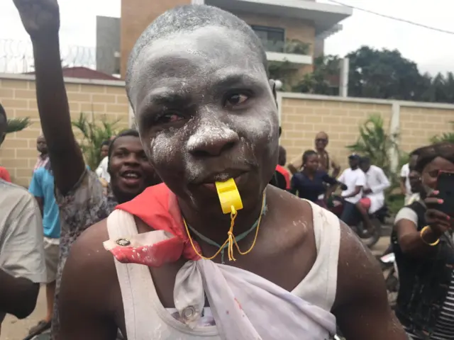 A jubilant man with a whistle