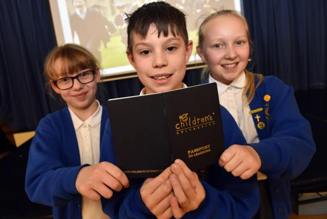 Children withe 'children's university passport'