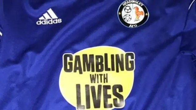 GAMBLING WITH LIVES LOGO ON T-SHIRT