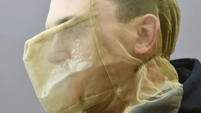 Man in spit guard