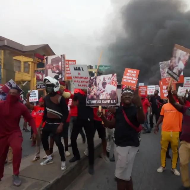 Protesters, wearing red, were demanding their money back from Menzgold in Kumasi