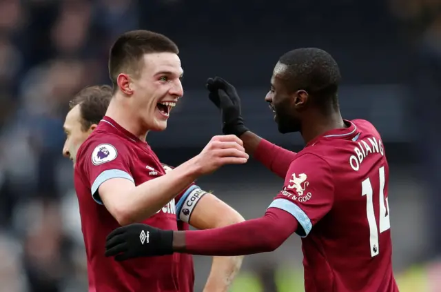 Declan Rice and Pedro Obiang celebrate at full-time