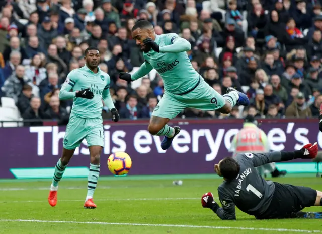 Lukasz Fabianski saves from Alexandre Lacazette