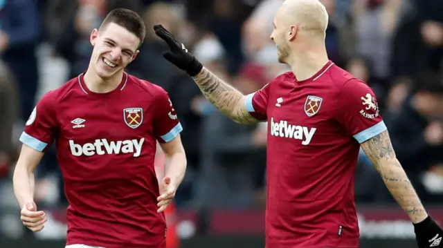 Declan Rice celebrates with Marko Arnautovic