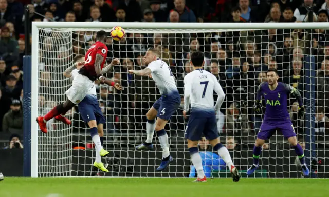 Paul Pogba heads towards goal