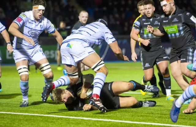 Glasgow Warriors' Oli Kebble bulldozes his way over for the home side's fourth try