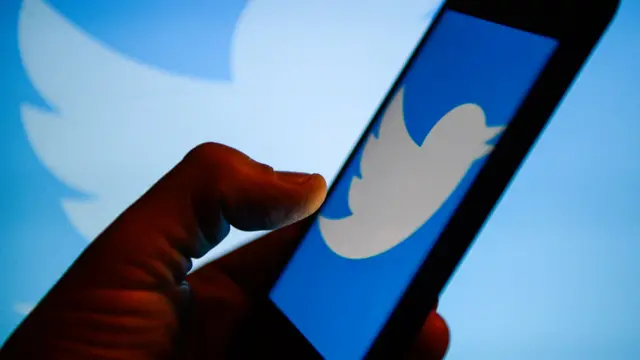 Twitter logo on a phone