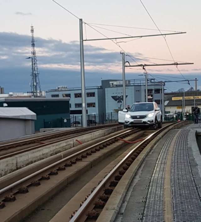 Car on tram tracks