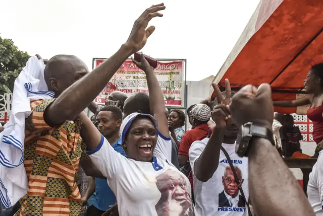 People celebrate on January 15, 2019 in Abidjan after the news that International Criminal Court acquitted former Ivory Coast president Laurent Gbagbo over a wave of post-electoral violence, in a stunning blow to the war crimes tribunal in The Hague.