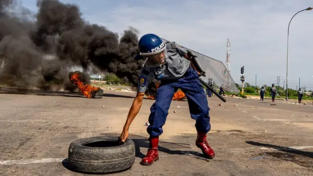 A riot policeman deployed in response to Zimbabwe's fuel protests