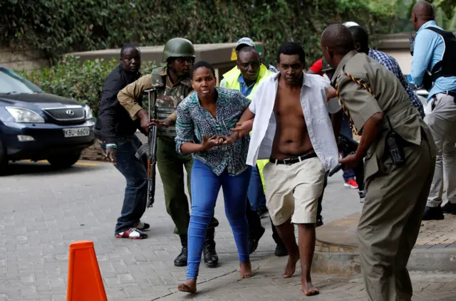 People are evacuated at the scene where explosions and gunshots were heard at the Dusit hotel compound, in Nairobi, Kenya January 15, 2019.