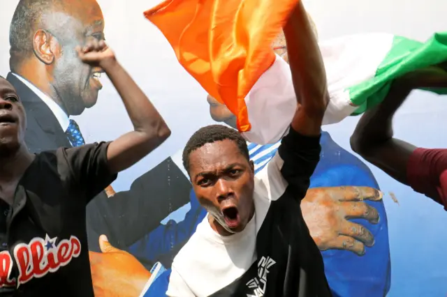 A Gbagbo supporter pictured on the street in Abidjan.