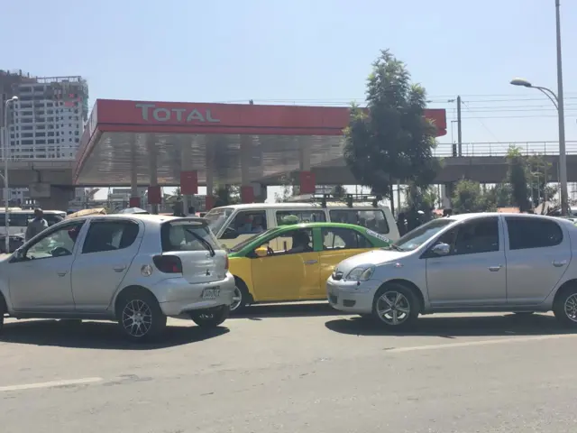 Cars around a fuel station