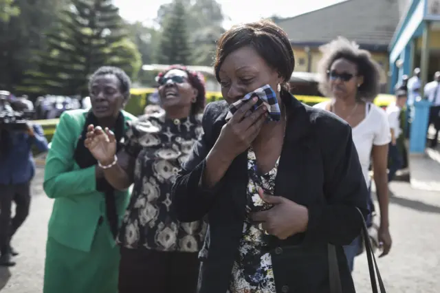 A woman reacts after seeing the body of her family member who were killed in an attack, at a mortuary in Nairobi, Kenya,