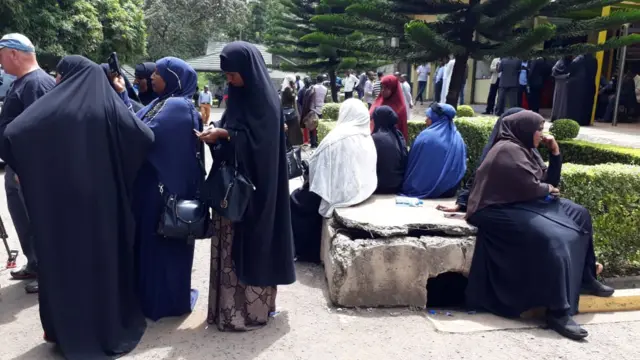 Family members waiting by the mortuary