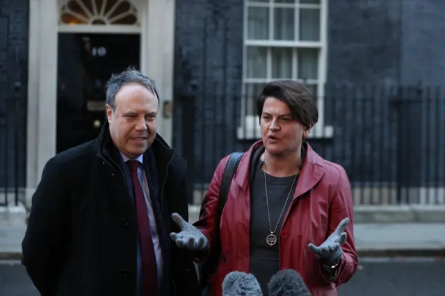 Northern Ireland"s Democratic Unionist Party (DUP) leader Arlene Foster and deputy Nigel Dodds speak to the press outside Downing street