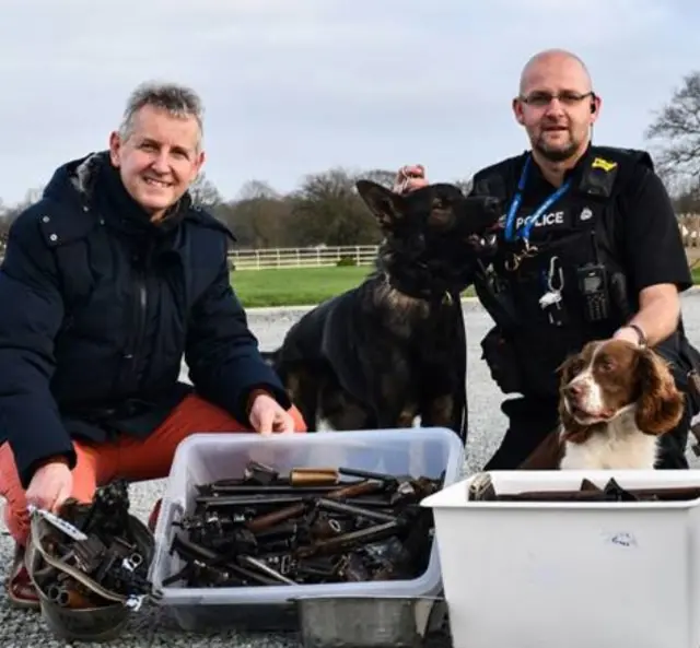 Police dogs, policeman and artist