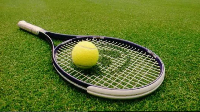 A stock photograph of a tennis racket and ball