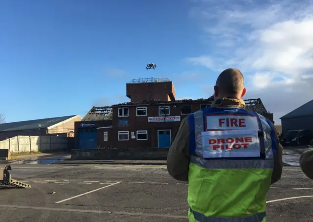 Drone flying over building