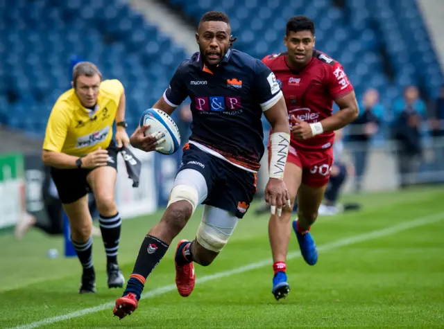 Bill Mata runs with the ball for Edinburgh