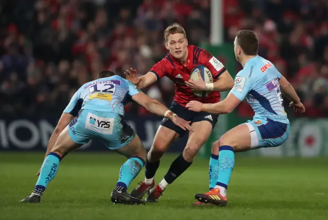 Mike Haley is tackled by Sam Simmonds and Ollie Devoto