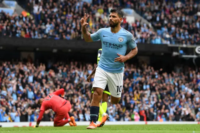 Sergio Aguero celebrates scoring a hat-trick against Huddersfield