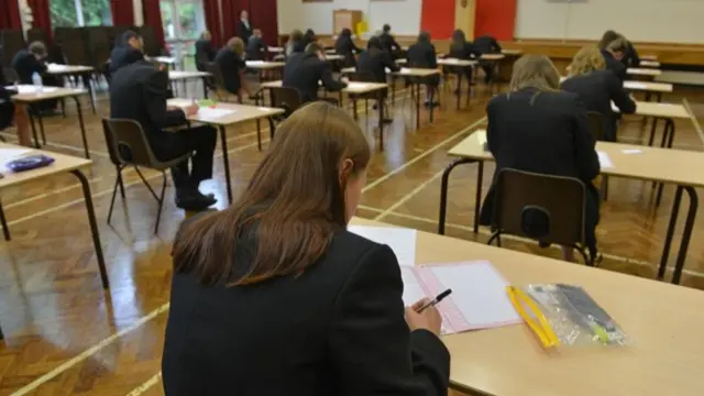 Children sitting exams at a school