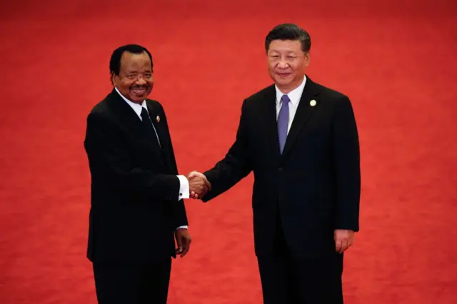 Cameroon's President Paul Biya (L) shakes hands with China's President Xi Jinping during the Forum on China-Africa Cooperation at the Great Hall of the People in Beijing on September 3, 2018.