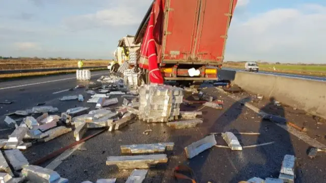 A lorry with its load on the road