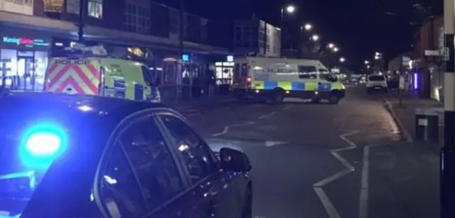 Police vehicles on street