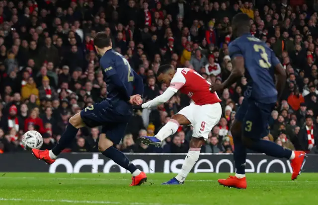 Alexandre Lacazette shoots at goal